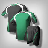 In the middle, a green soccer jersey with thick white lining along the shoulder to the under arm with black underneath the biceps and along the hip going downward from the sides. Behind, a black soccer jersey with thick white lining along the shoulder to the under arm with green underneath the biceps and along the hip going downward from the sides. At the corner of the photo, one black short with green lining.